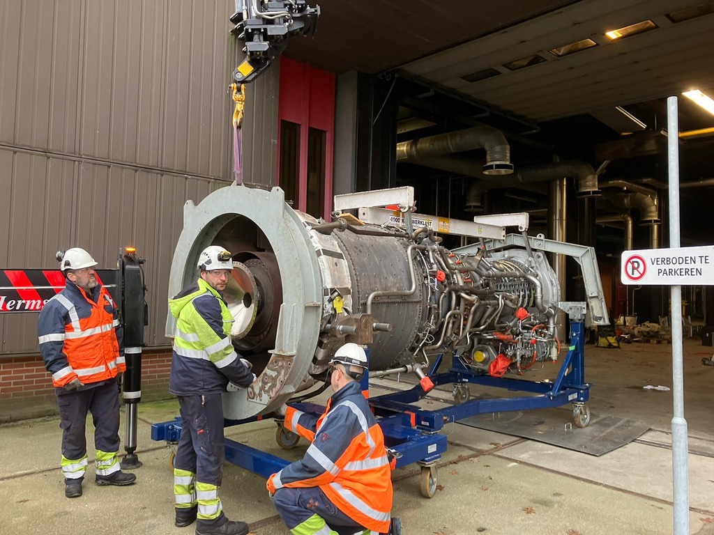 Technicians working together on a gas turbine